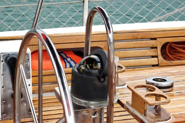 Metal Large Steering Wheel And Compass On The Sailboat © Alex
