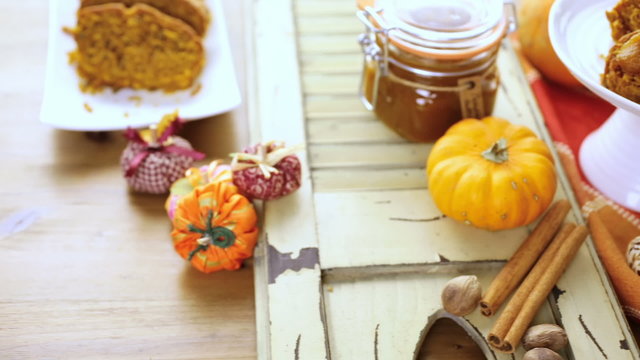 Homemade pumpkin butter with pumpking bread on the table