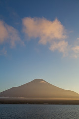 Mountain Fuji and cloud with beautiful sunset sky at lake Yamanakako in summer evening