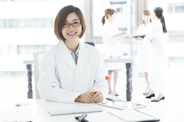 Women's portrait wearing a white coat
