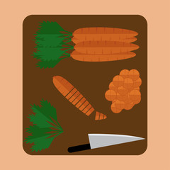 Carrot sliced on wood butcher with knife top view.