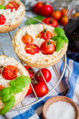 sand tarts with goat cheese and cherry tomatoes, vegetarian food
