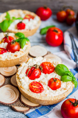 sand tarts with goat cheese and cherry tomatoes, vegetarian food