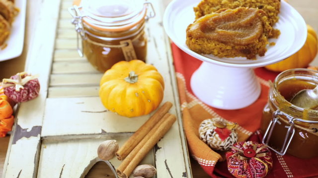 Homemade pumpkin butter with pumpking bread on the table