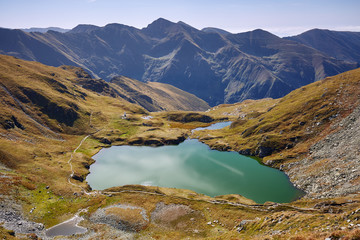 Fototapeta na wymiar Glacial lake between mountains