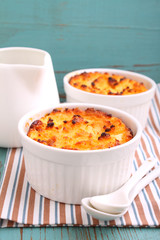 curd pudding in white bowl on an old blue background