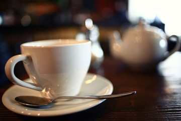 cup of tea at a cafe blurred background