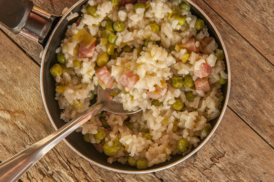 Lemon risotto with bacon and peas close up