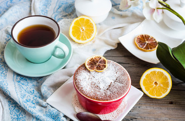 lemon pudding with red plates on a white tablecloth