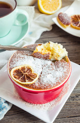 lemon pudding with red plates on a white tablecloth