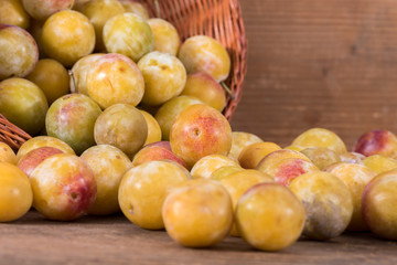 Fresh mirabelles with basket