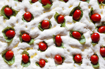 food pizza pattern.raw pizza dough close-up. with cherry tomatoe