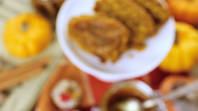 Homemade pumpkin butter with pumpking bread on the table