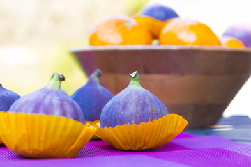 Delicious figs and mandarines outdoors