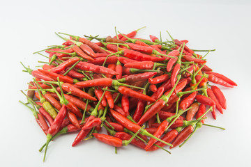 A bunch of small red hot chilli peppers, isolated