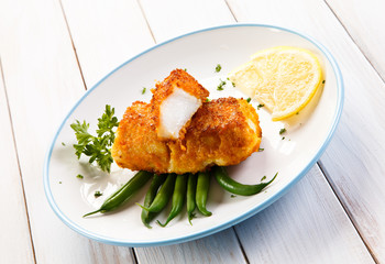 Fish dish - fried fish fillets and vegetables 