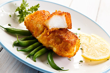 Fish dish - fried fish fillets and vegetables 