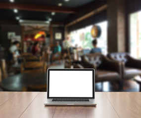 Blank screen laptop computer with blue coffee shop background