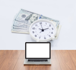 Blank screen laptop computer with blur money and clock backgroun