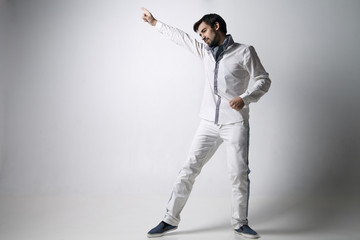 Portrait of an emotional young man wearing white.