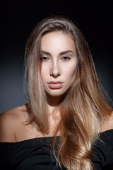 Portrait of beautiful girl with healthy long hair