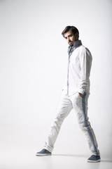 Portrait of an emotional young man wearing white.