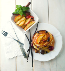 Pancakes with honey, hazelnuts and currants