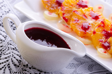 dessert of orange slices  with  sauce