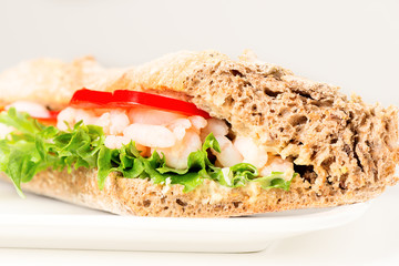 Prawn sandwich on white plate