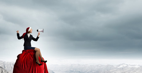 Female Santa with megaphone