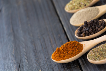 Spices and herbs in  bowls.