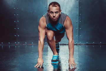 Runner, sportsman muscular man in a position of readiness, sport, run