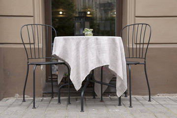 Fototapeta na wymiar Cafe Table and Chair in Antonijas Iela Street, Riga