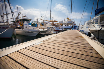 Marina with anchored boats - Powered by Adobe
