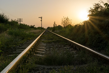 Fototapeta na wymiar Dramatic sunset at the railway tracks