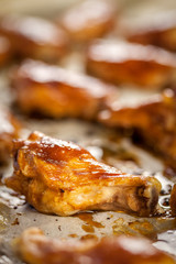 Roasted chicken wings on the baking paper