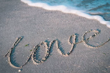 Foto op Plexiglas the word love on a tropical beach © Oleandra9