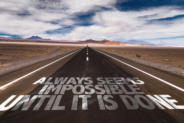 Always Seems Impossible Until it is Done written on desert road