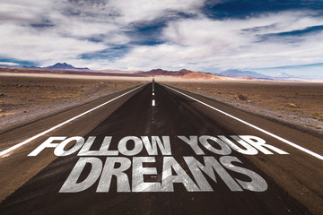 Follow Your Dreams written on desert road