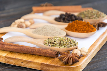 Spices and herbs in  bowls.