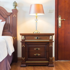 Pillow on bed with light lamp