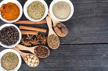 Spices and herbs in  bowls.