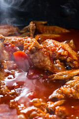 Stewed chicken in tomato sauce