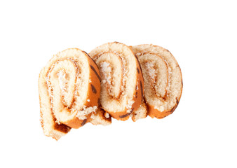 Three slices of roll cake isolated on white