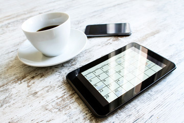 Checking monthly activities in the calendar in the tablet