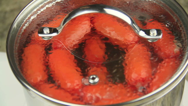 Australian frankfurters called cheerios seen cooking through the glass lid 