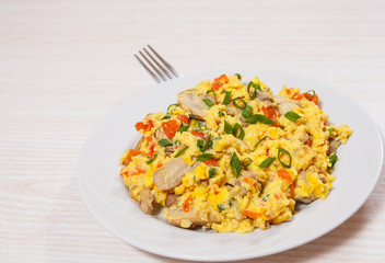 scrambled eggs with mushrooms and vegetables
