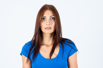 Portrait of a young and beautiful woman in a blue T-shirt