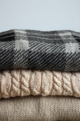 beautiful stack of warm sweaters closeup