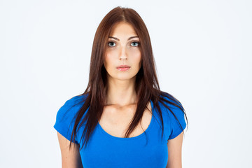 Obraz premium Portrait of a young and beautiful woman in a blue T-shirt